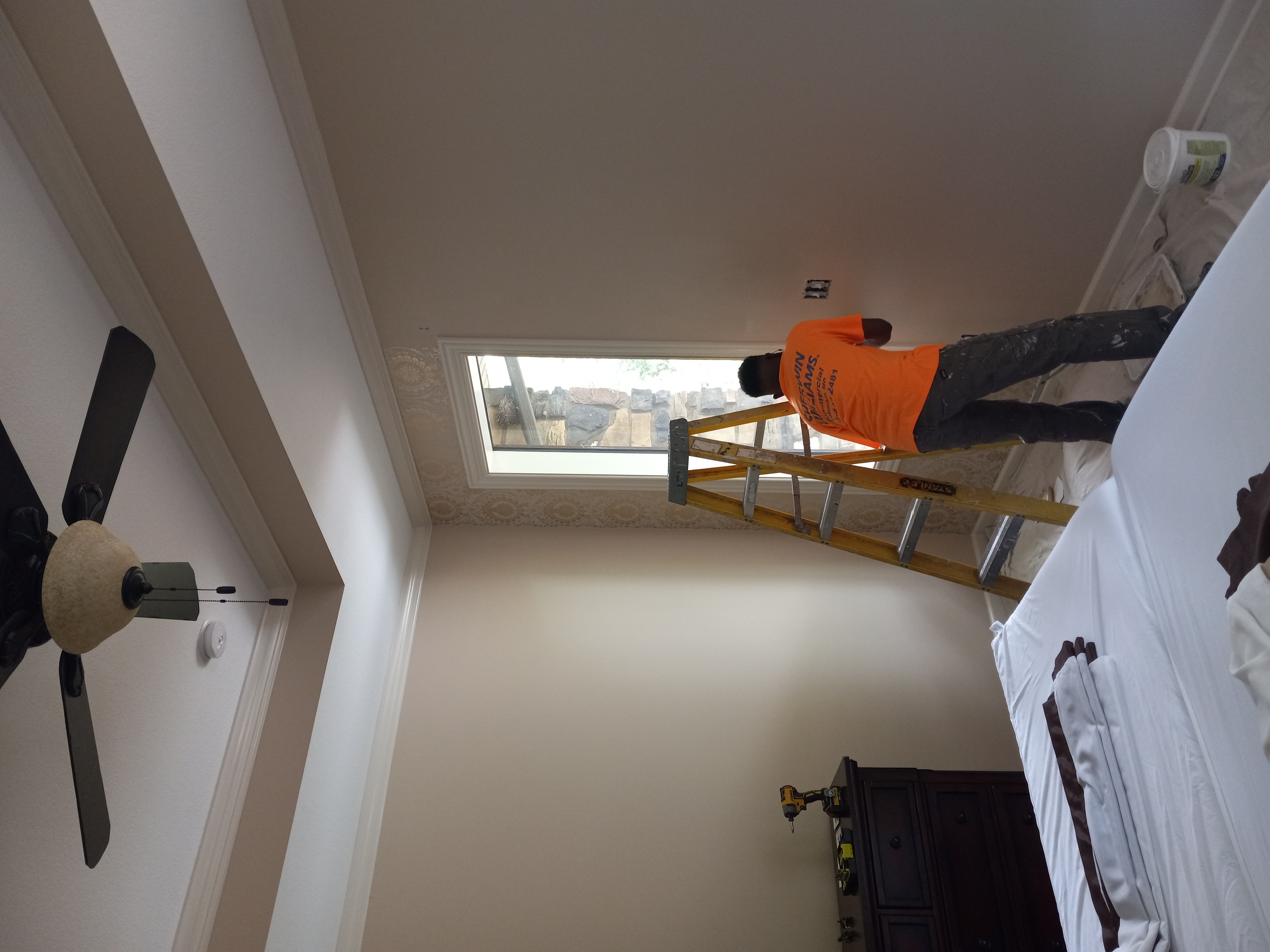 Rock and Roll Construction team member painting